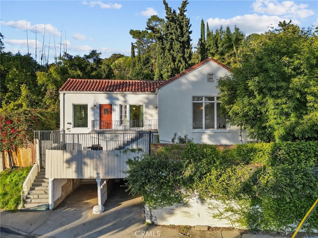 mediterranean / spanish house with a carport