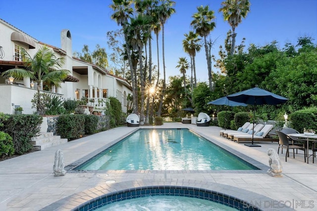 view of pool featuring a patio