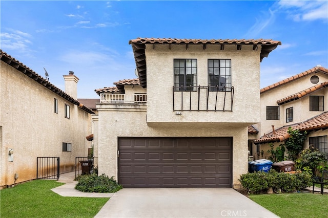 mediterranean / spanish home with a garage