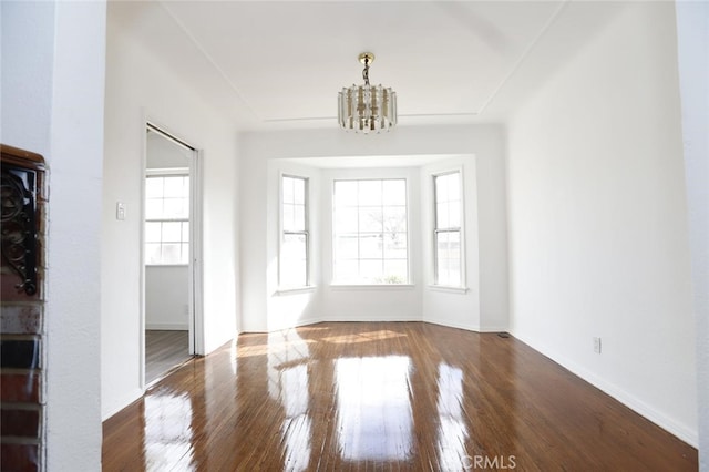 interior space with dark hardwood / wood-style floors and a chandelier