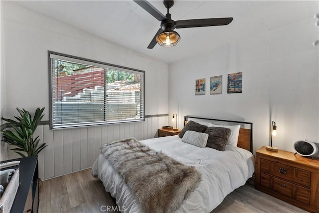 bedroom featuring wood-type flooring and ceiling fan