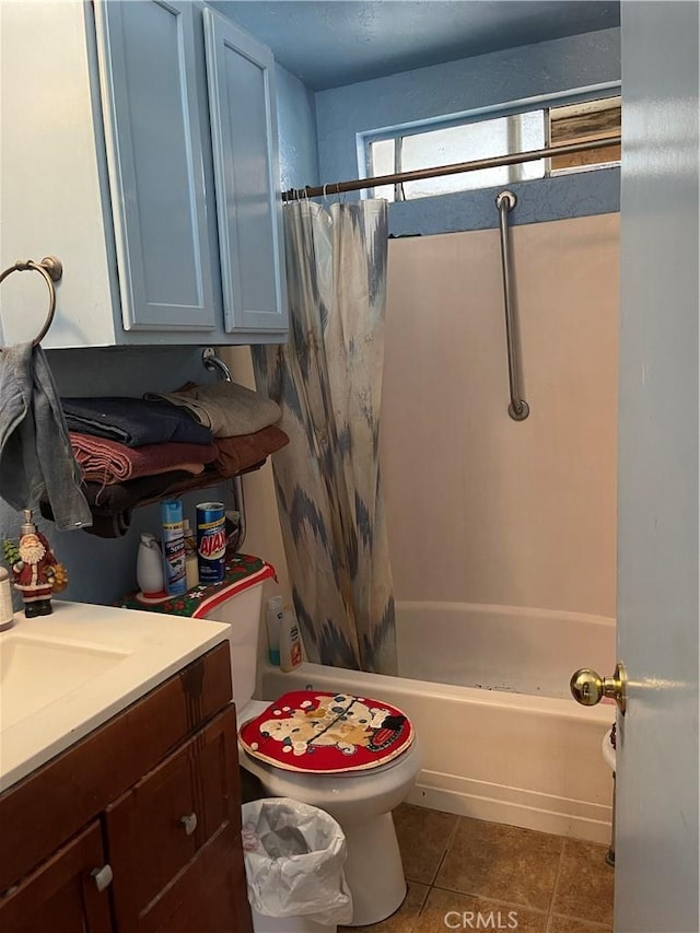 full bathroom featuring tile patterned flooring, vanity, toilet, and shower / bathtub combination with curtain