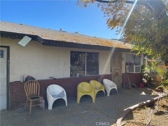 rear view of house with a patio