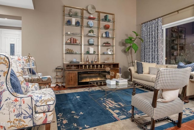 living area with hardwood / wood-style flooring