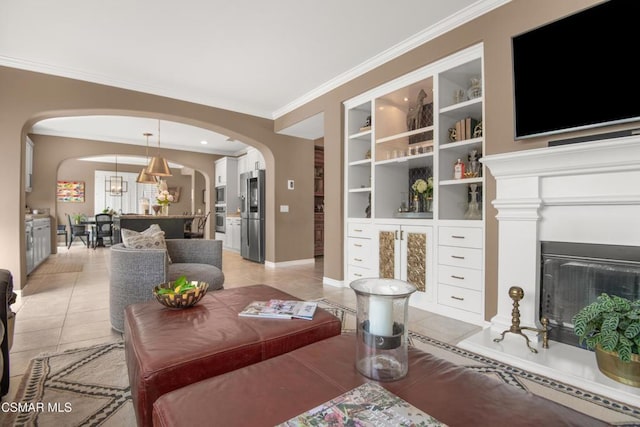 living room featuring a notable chandelier, crown molding, built in features, and light tile patterned flooring