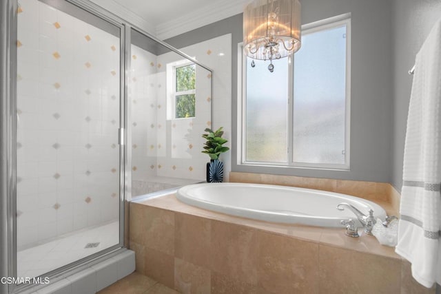 bathroom with tile patterned floors, ornamental molding, shower with separate bathtub, and a chandelier