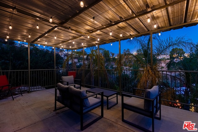 patio terrace at dusk with an outdoor hangout area