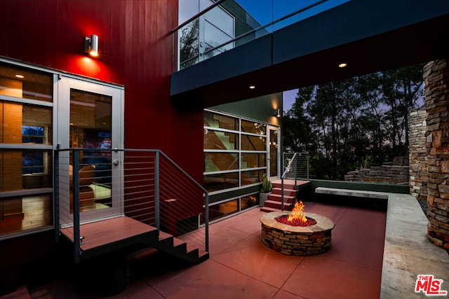 patio terrace at dusk with a fire pit