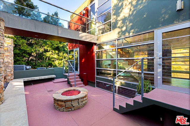 view of patio featuring an outdoor fire pit