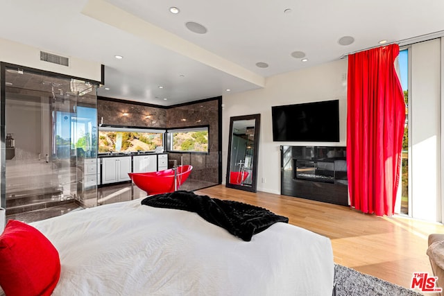 bedroom with hardwood / wood-style floors