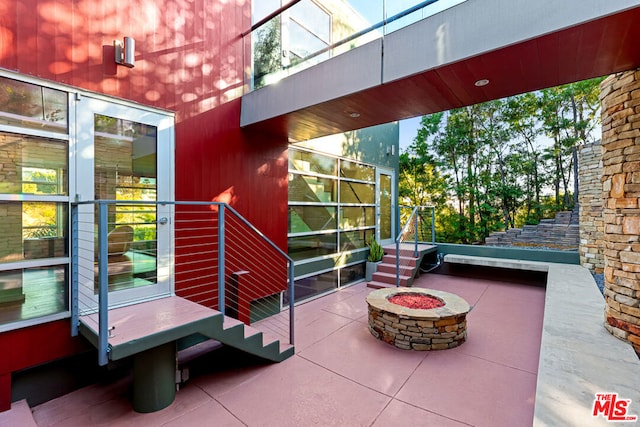 view of patio featuring a fire pit