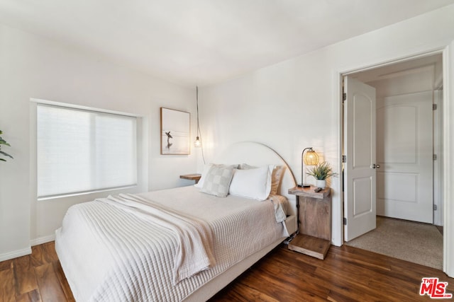 bedroom featuring dark wood-type flooring