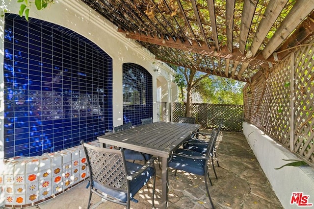 view of patio featuring a pergola