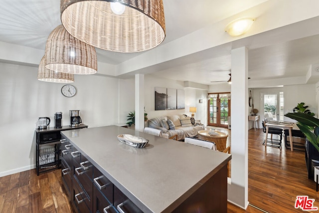 kitchen with dark hardwood / wood-style floors, french doors, and a kitchen island