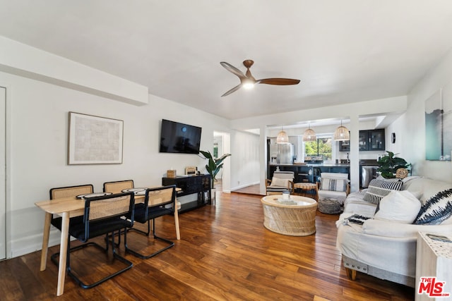 living room featuring hardwood / wood-style flooring and ceiling fan