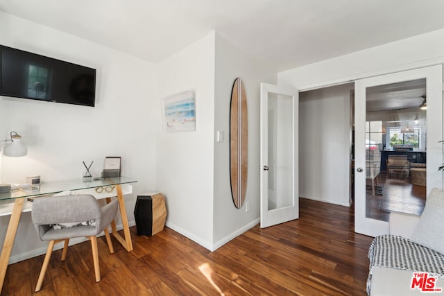 home office featuring dark hardwood / wood-style flooring and french doors