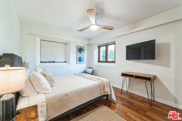 bedroom featuring hardwood / wood-style flooring and ceiling fan