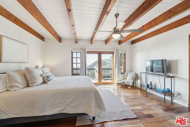 bedroom with hardwood / wood-style flooring, access to outside, and beamed ceiling