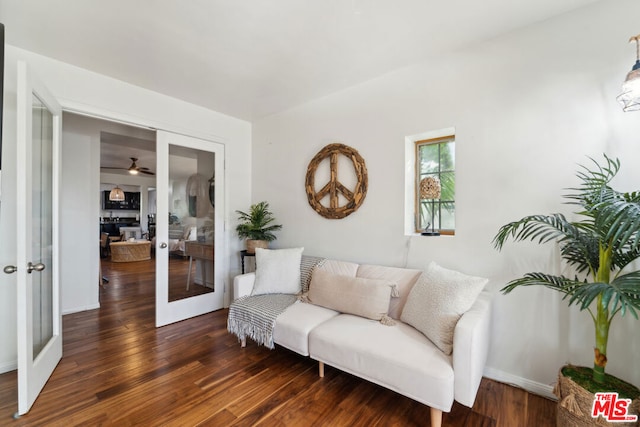 sitting room featuring dark hardwood / wood-style flooring and french doors