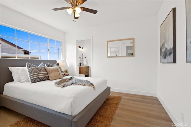 bedroom featuring hardwood / wood-style flooring and ceiling fan