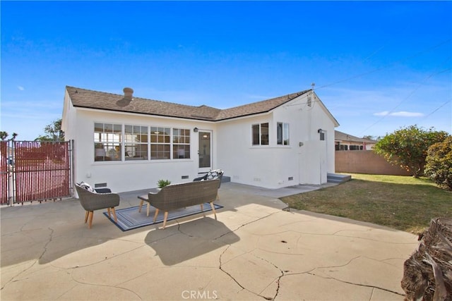 rear view of property featuring a yard and a patio area