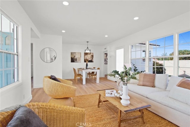 living room featuring a healthy amount of sunlight and light wood-type flooring