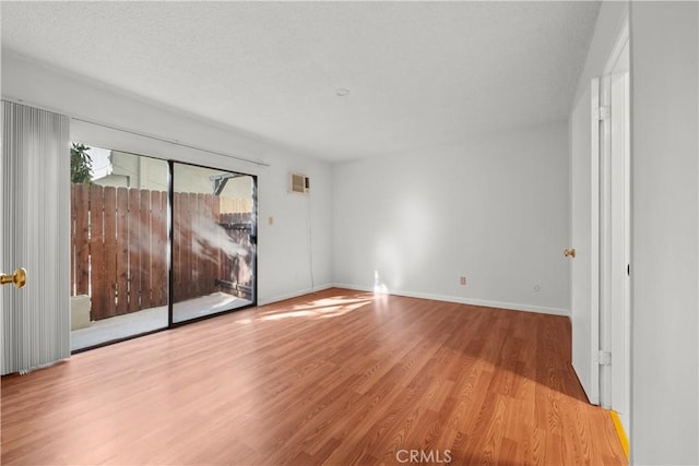 unfurnished room with light wood-type flooring