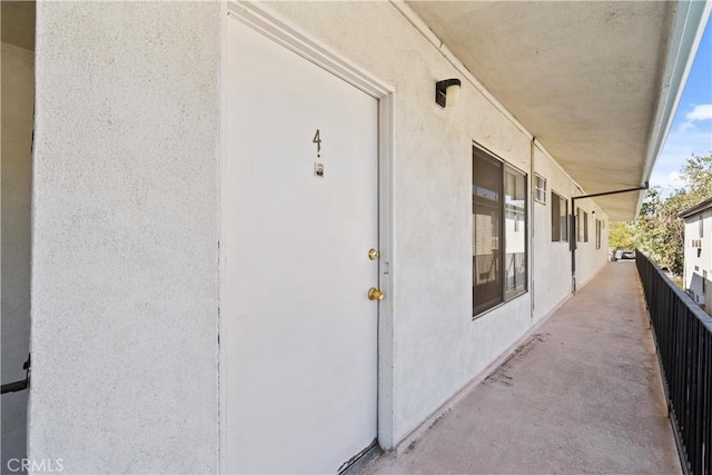 entrance to property featuring a balcony