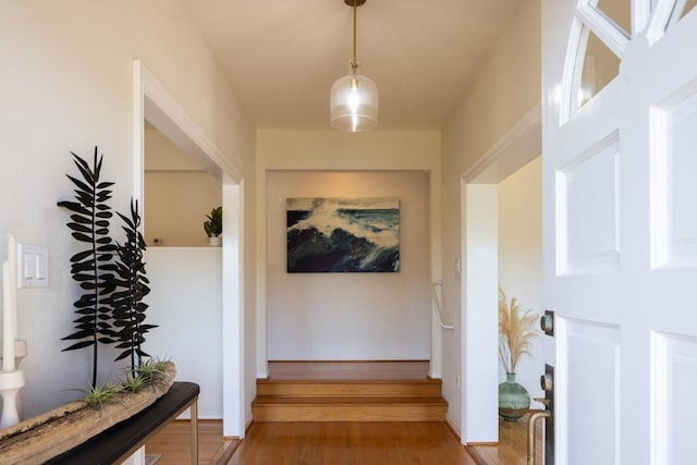 hallway with wood-type flooring