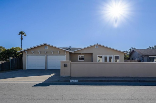 ranch-style house featuring a garage