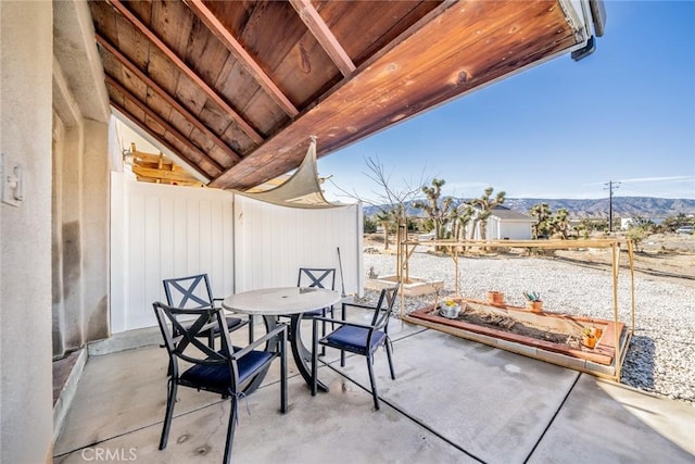 view of patio / terrace with a mountain view