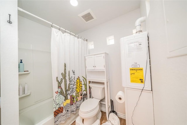 bathroom with hardwood / wood-style floors, shower / bath combination with curtain, and toilet