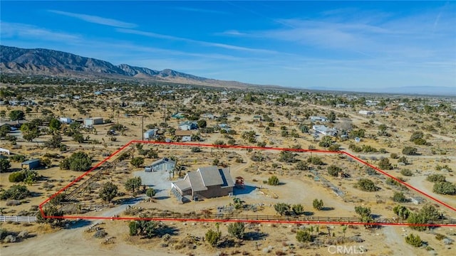 birds eye view of property featuring a mountain view