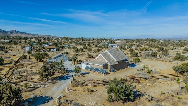 birds eye view of property with a rural view and a mountain view