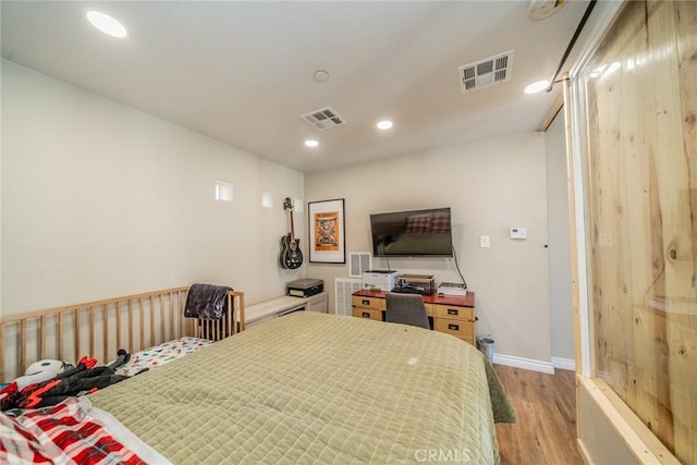 bedroom featuring light hardwood / wood-style flooring