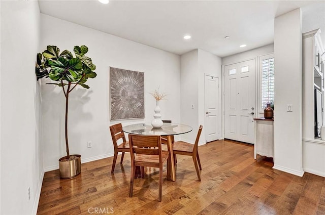 dining space featuring hardwood / wood-style flooring