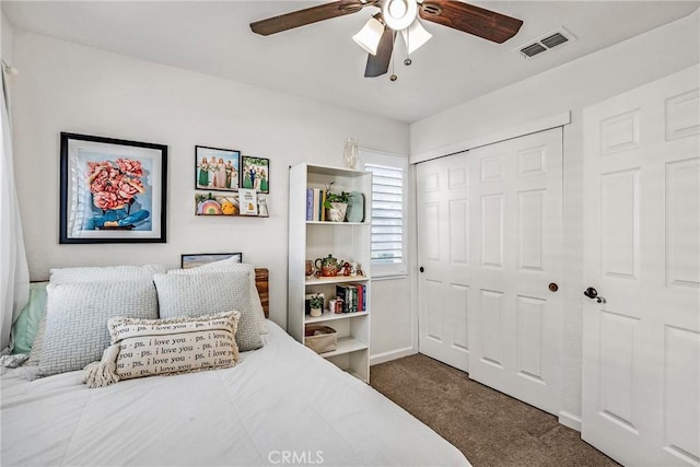 carpeted bedroom featuring ceiling fan and a closet