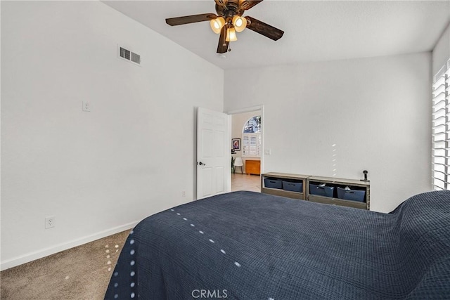 bedroom with vaulted ceiling, carpet, and ceiling fan