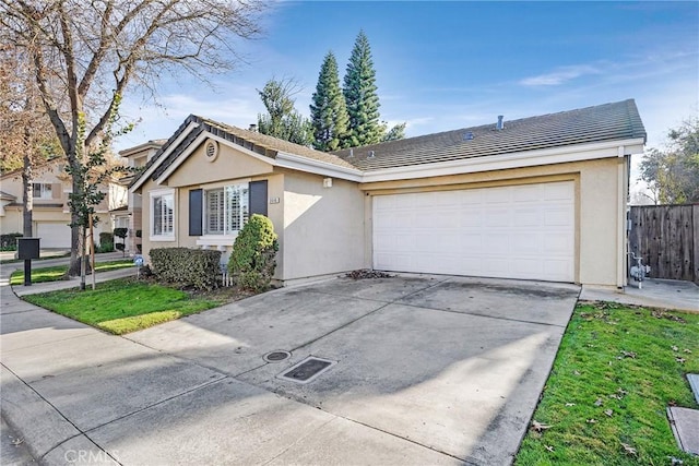 single story home featuring a garage