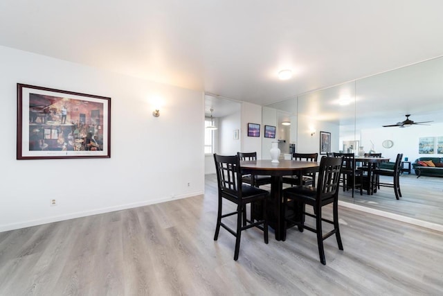 dining area featuring ceiling fan and light hardwood / wood-style flooring