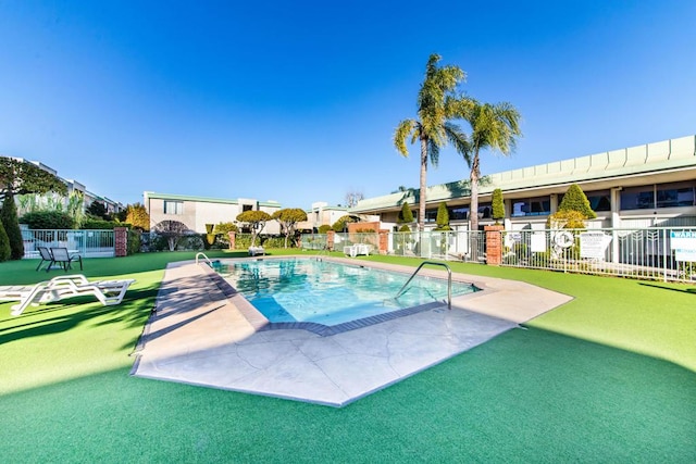 view of swimming pool with a patio