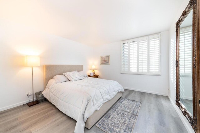 bedroom with light hardwood / wood-style floors