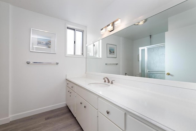 bathroom featuring wood-type flooring and vanity