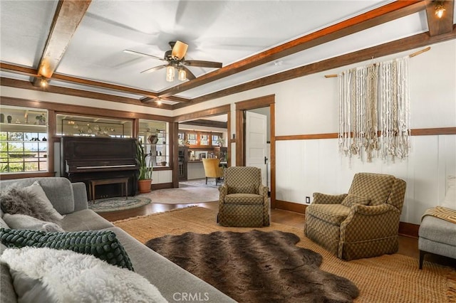 living room with beamed ceiling and ceiling fan