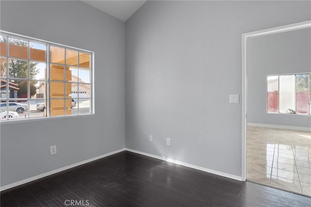 spare room with wood-type flooring