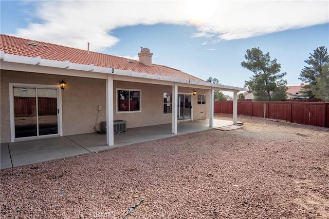 back of property with a patio