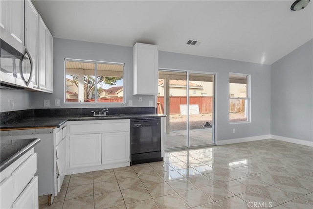 kitchen with white cabinetry, sink, dishwasher, and light tile patterned flooring