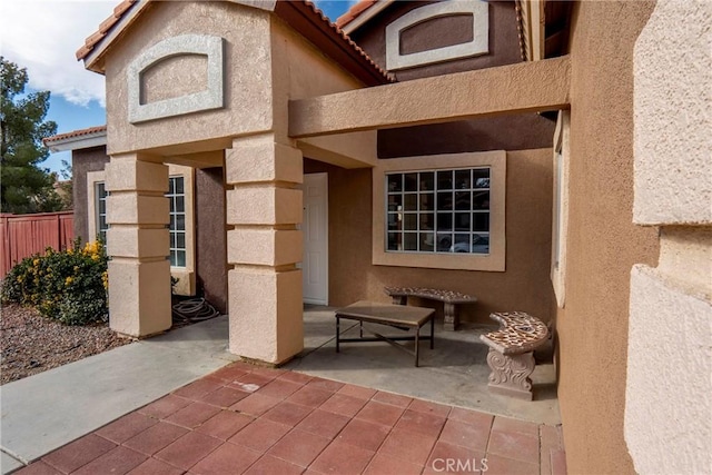 property entrance with a patio area