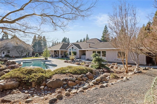 view of swimming pool with a patio