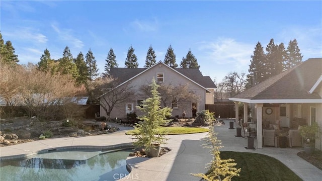 back of house with a patio